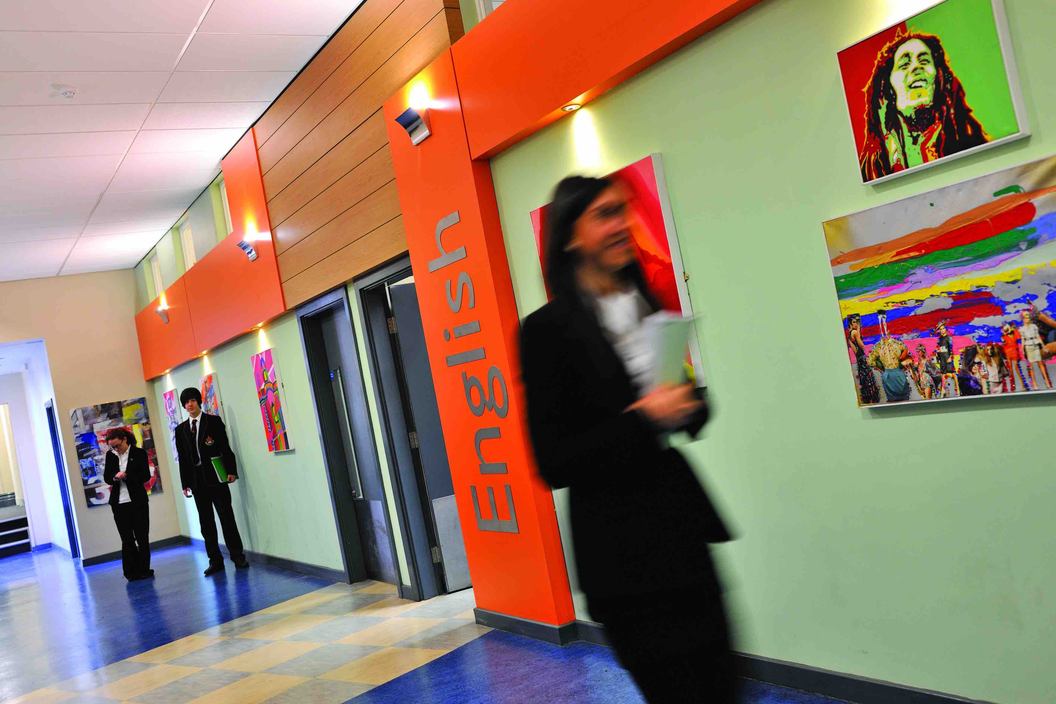 Student in a School Corridor