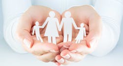 hands holding a family 