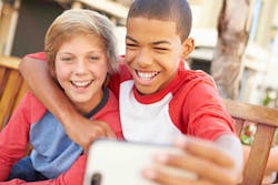 Two boys posing for a selfie