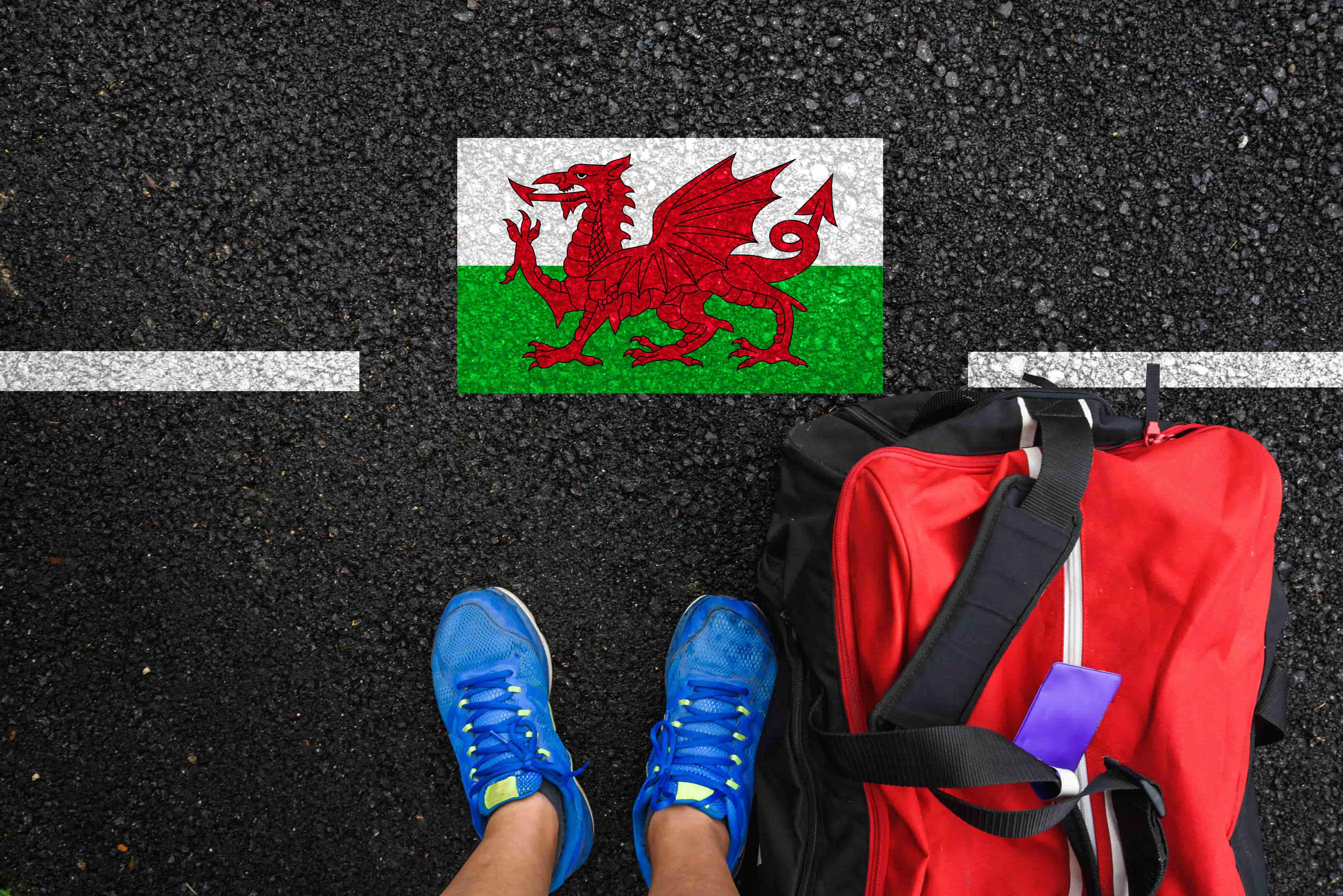 welsh flag with trainers and bag