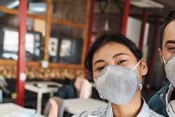 happy students in masks