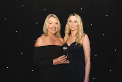 Lana and Charlotte with the award