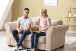 a student and adult talking