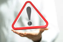 exclamation mark sign in hand