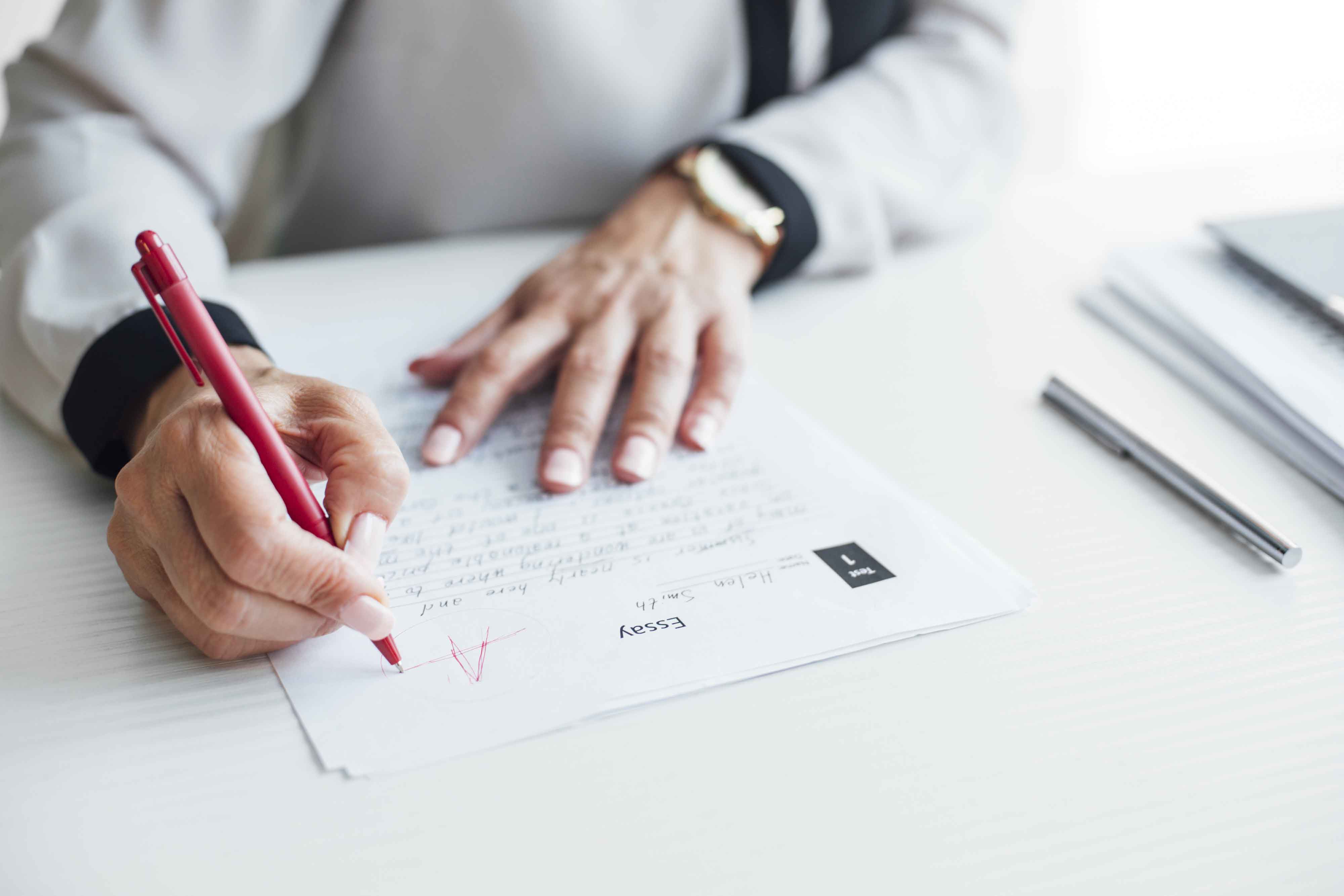 child writing on paper