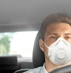 Taxi driver wearing a mask