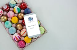 easter eggs painted in a box with mobile phone 