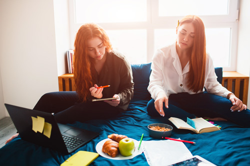girls in boarding house studying 