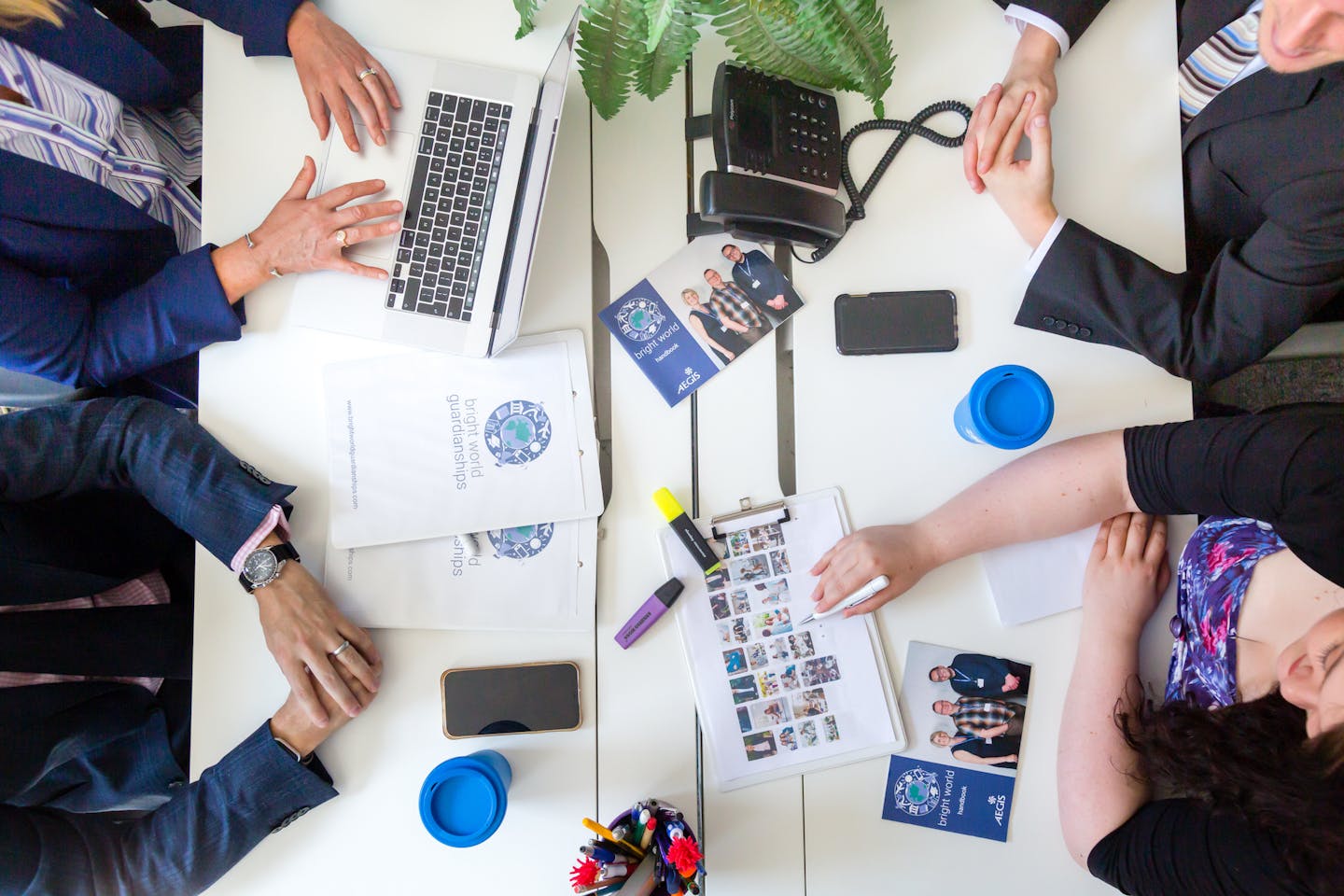 people at Bright World working at a desk