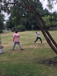 playing swingball in the garden 