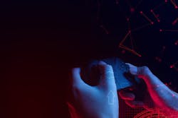 hands holding a gaming controller