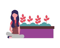 Girl sat beside plants