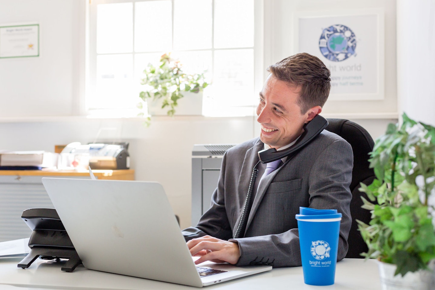 man at desk with laptop