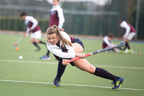 girl playing hockey