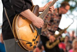 people playing live music to an audience