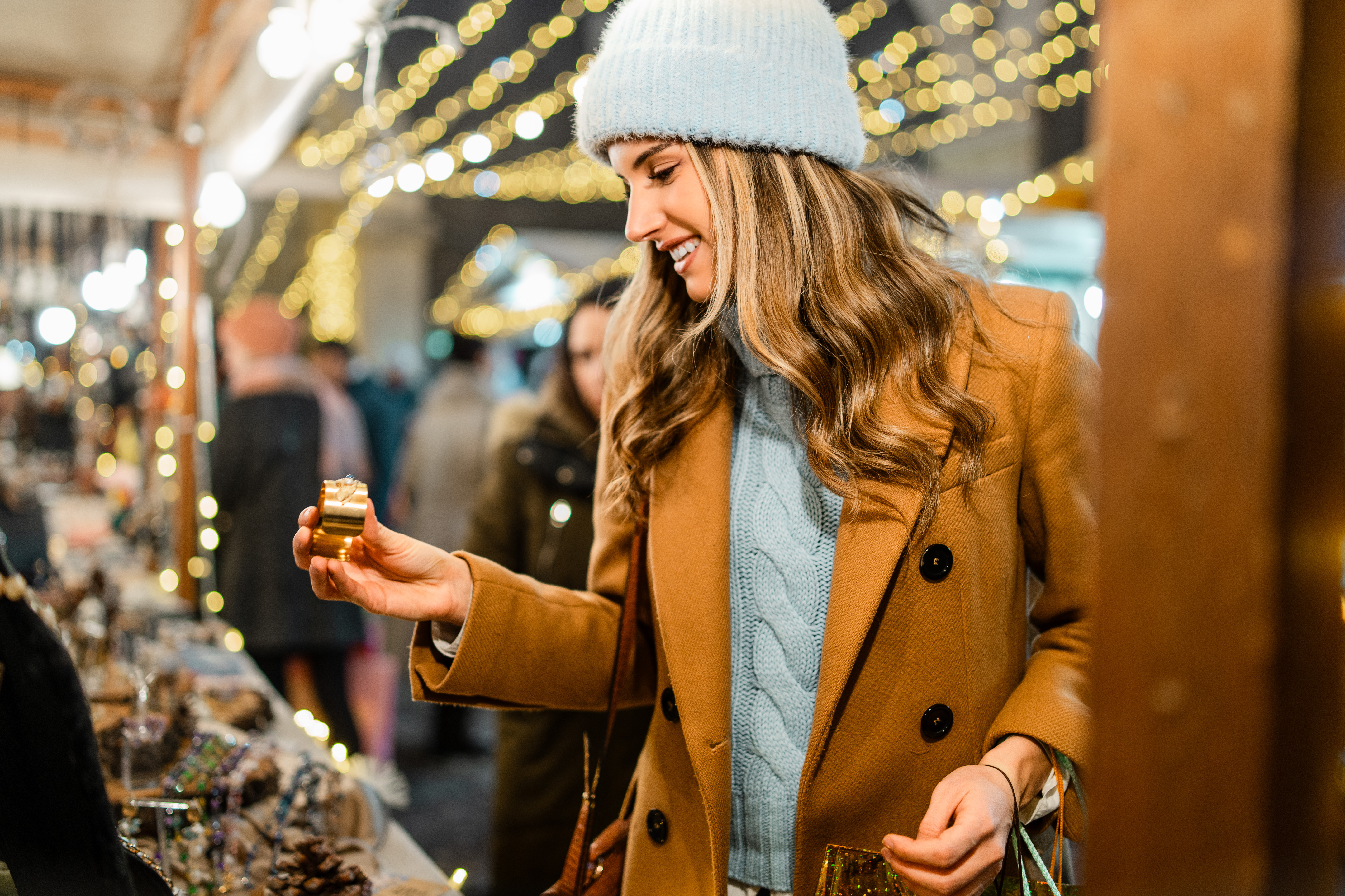 a young woman shopping at a market stall