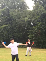 student playing garden darts