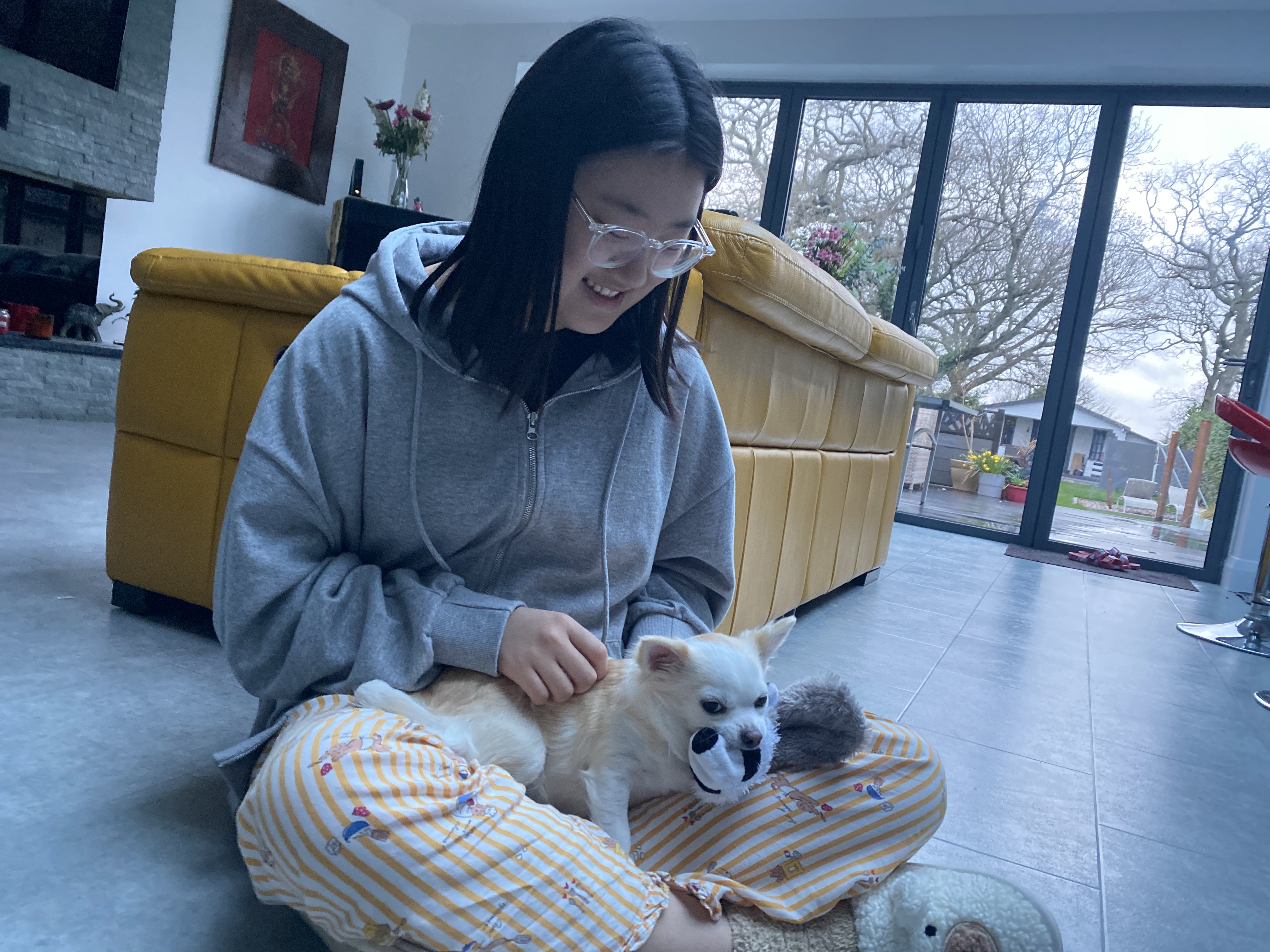 child on floor with dog 