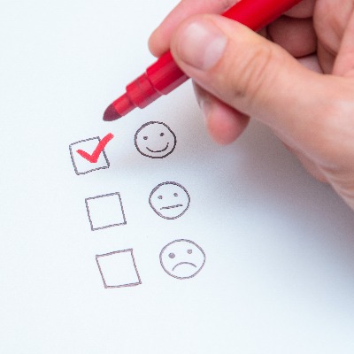 smiley face with a tick