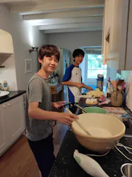 two students cooking