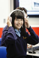 girl at Bishopstrow College with headphones on 