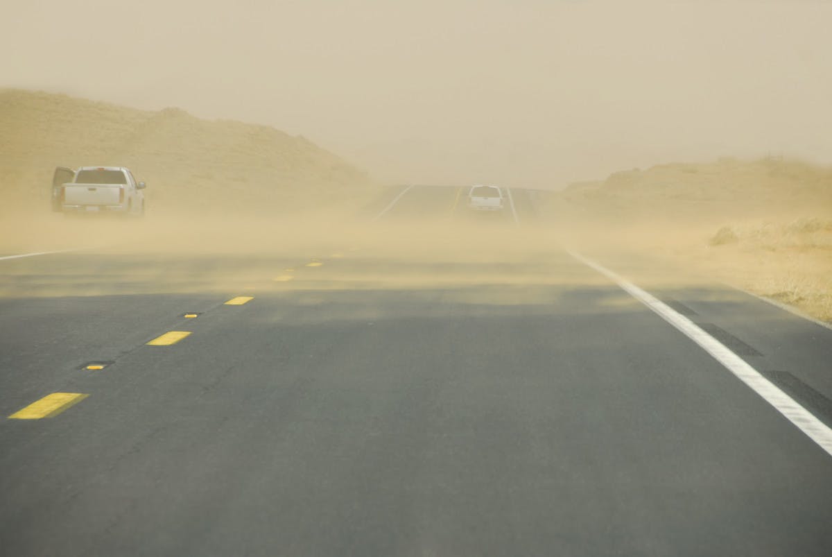 Sandstorm damage to cars in Iceland is caused by sand and ash storms blowing loose ash and gravel off the ground towards the car. 