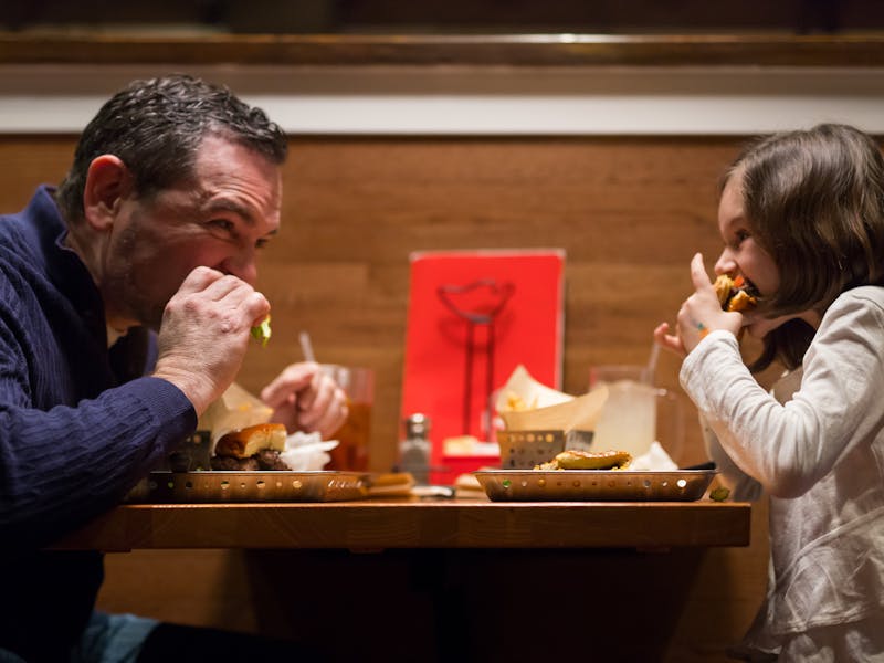 Dad & daughter enjoying a meal at Chili's together.