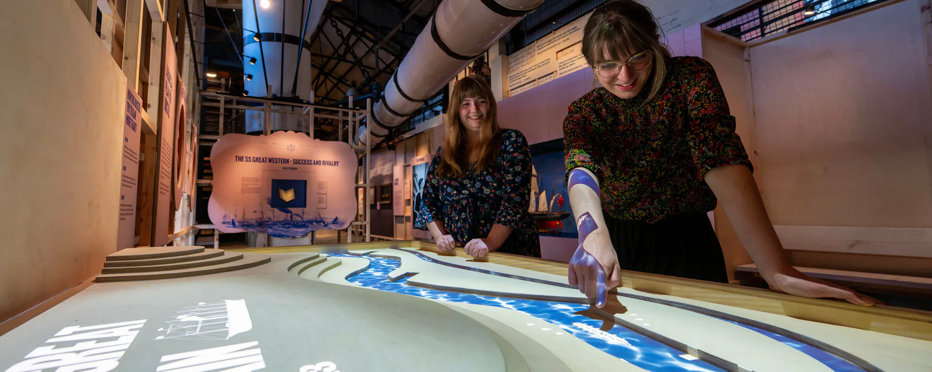 Two visitors exploring the new museum 