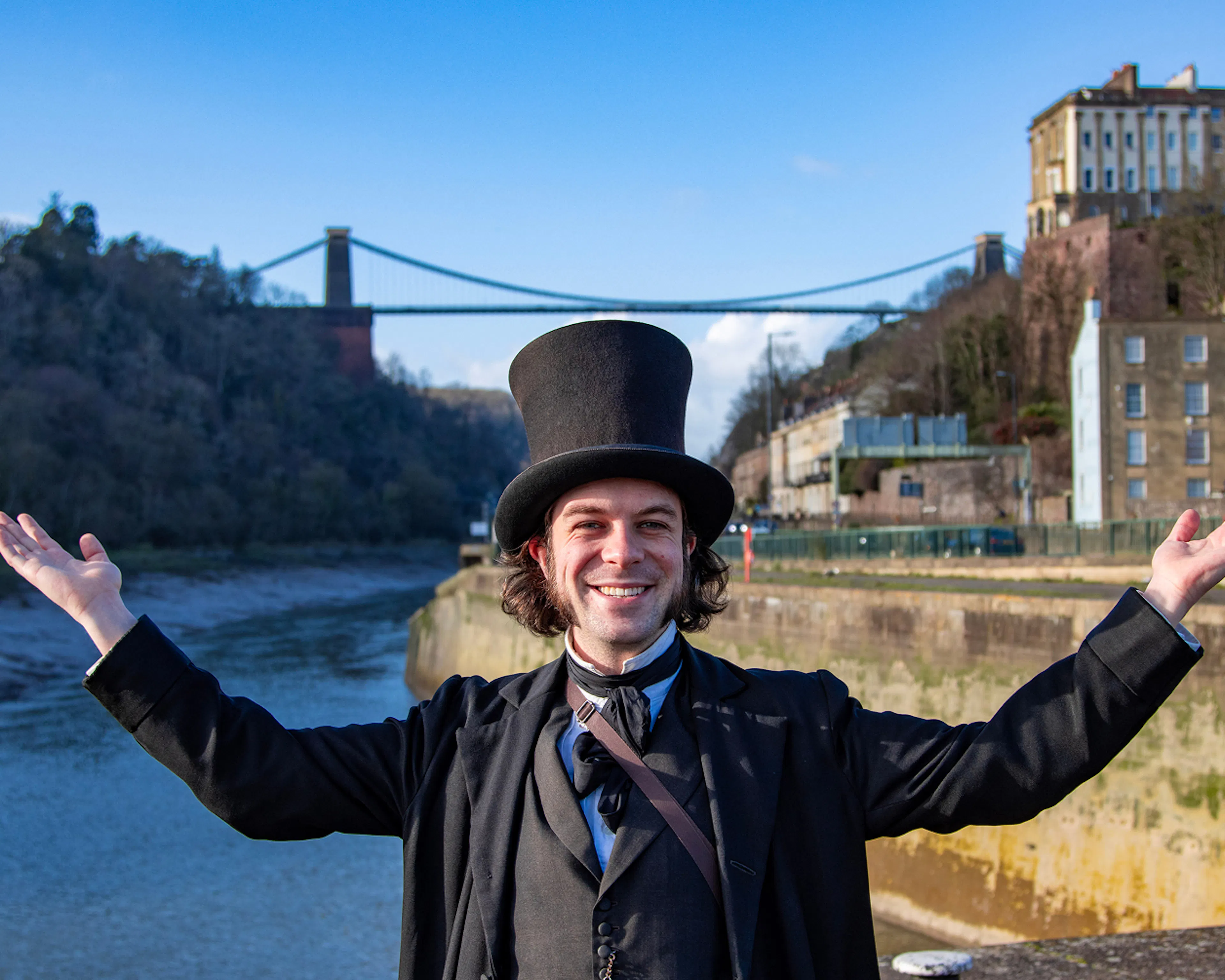 Brunel stood in front of Clifton Suspension Bridge leading a tour for Bristol Dockyards 