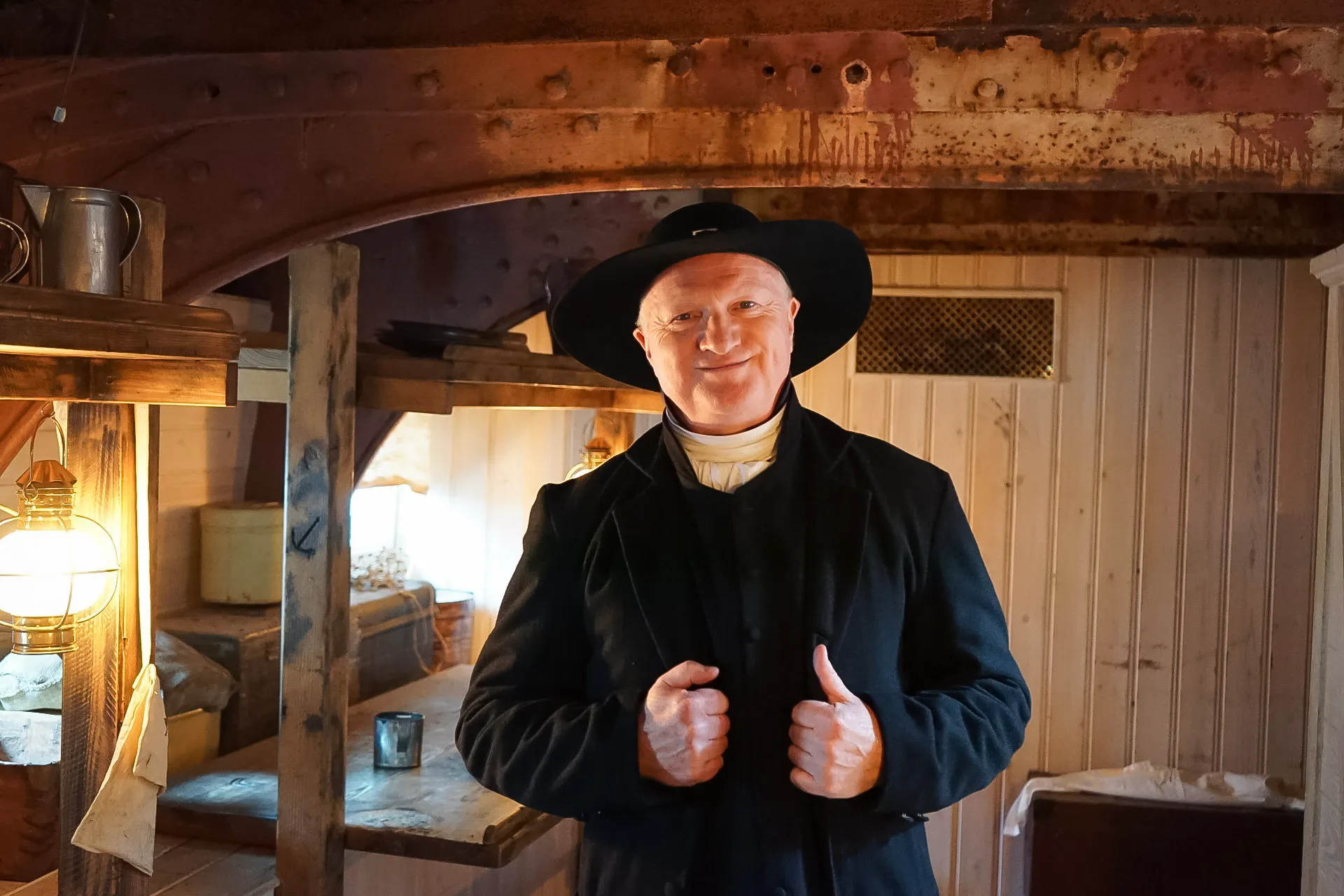 A man dressed in period costume on board the ship