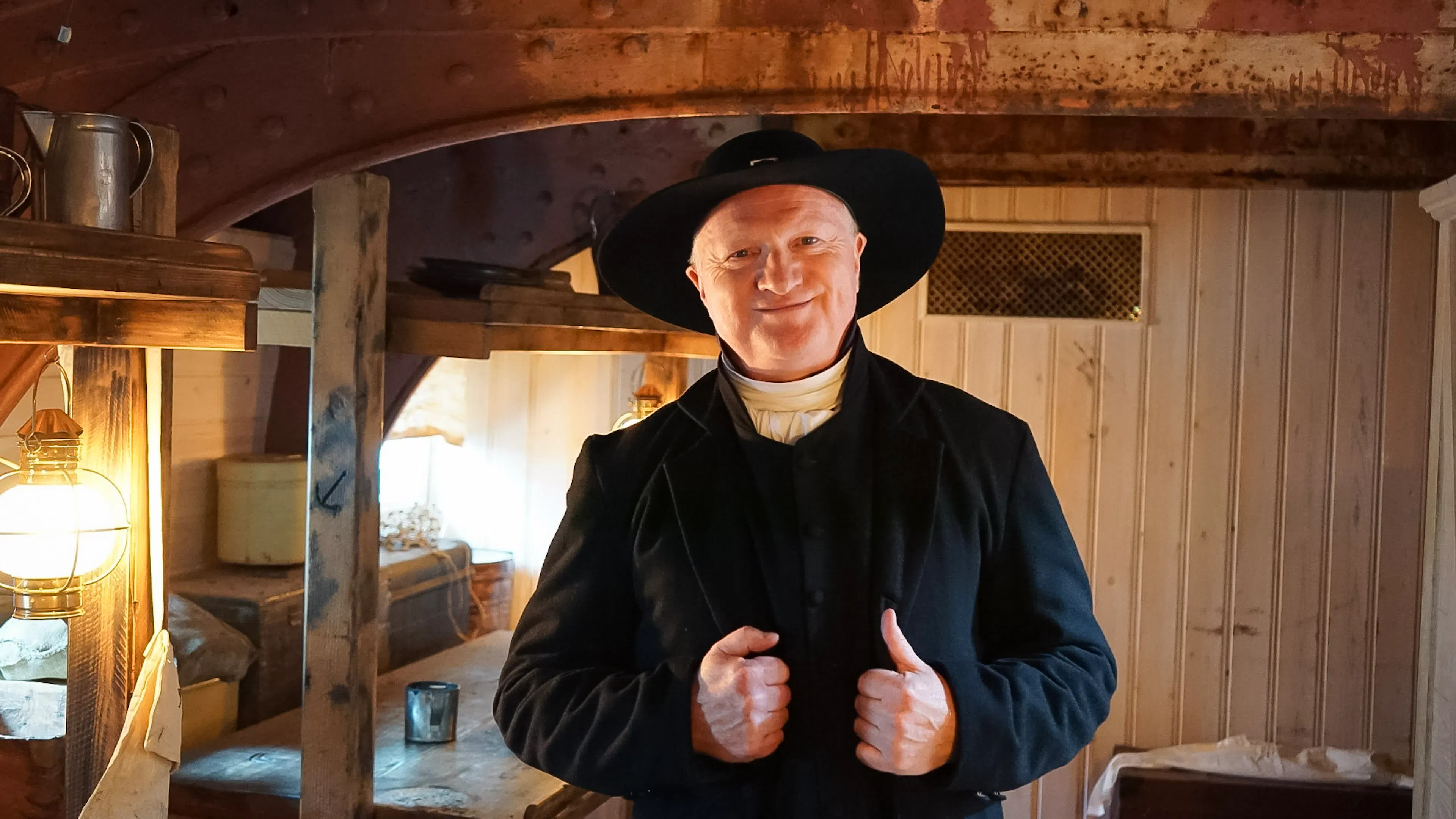 A man dressed in period costume on board the ship 