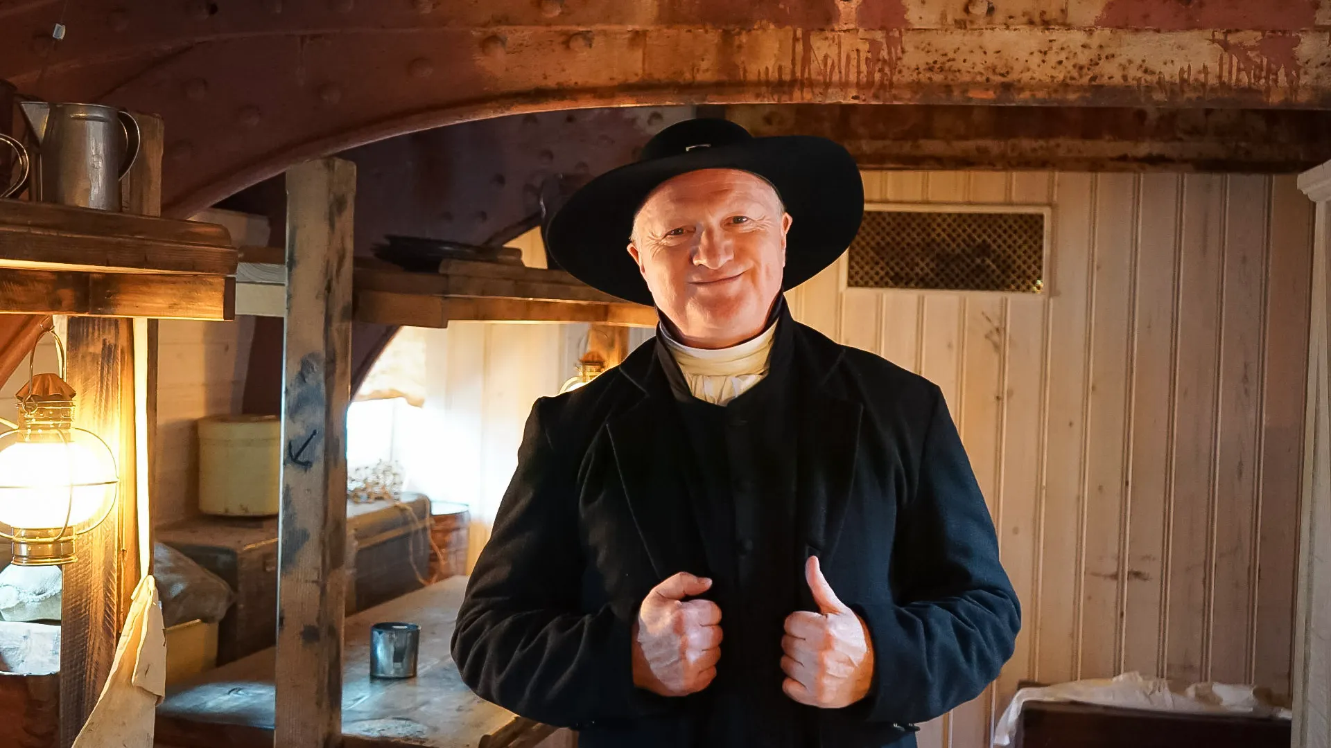 A man dressed in period costume on board the ship