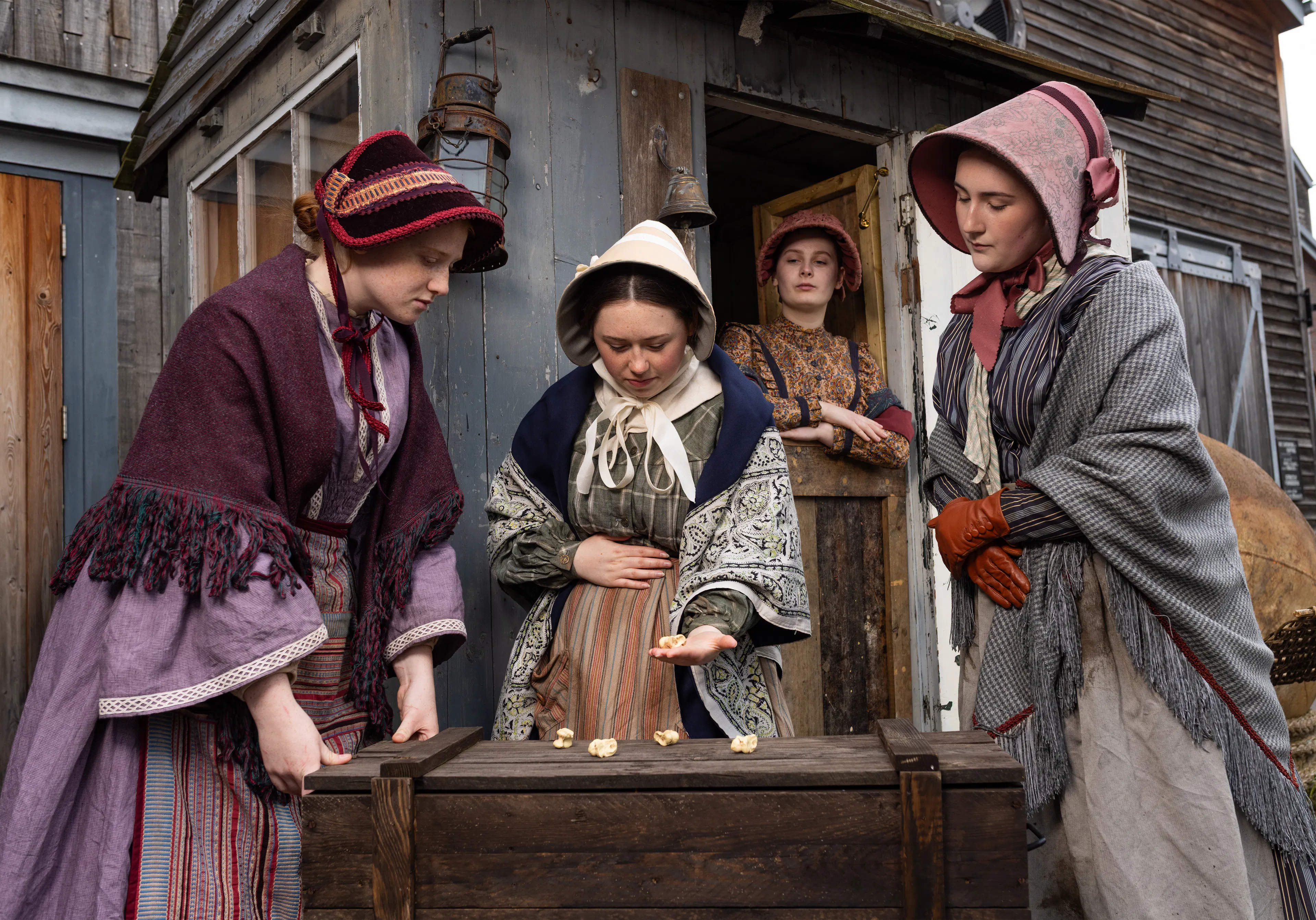 Four costumed Victorian volunteers at Bristol Dockyards 