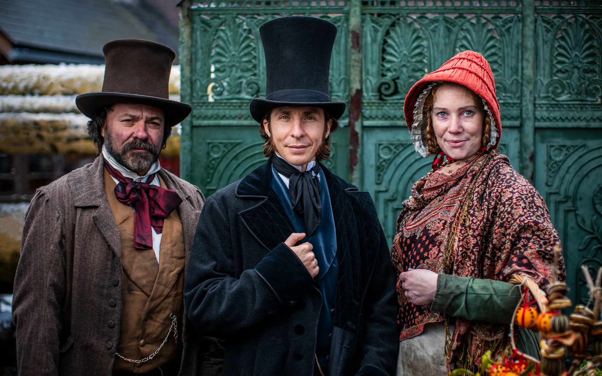 Three costume Victorian passengers ready to board the SS Great Britain