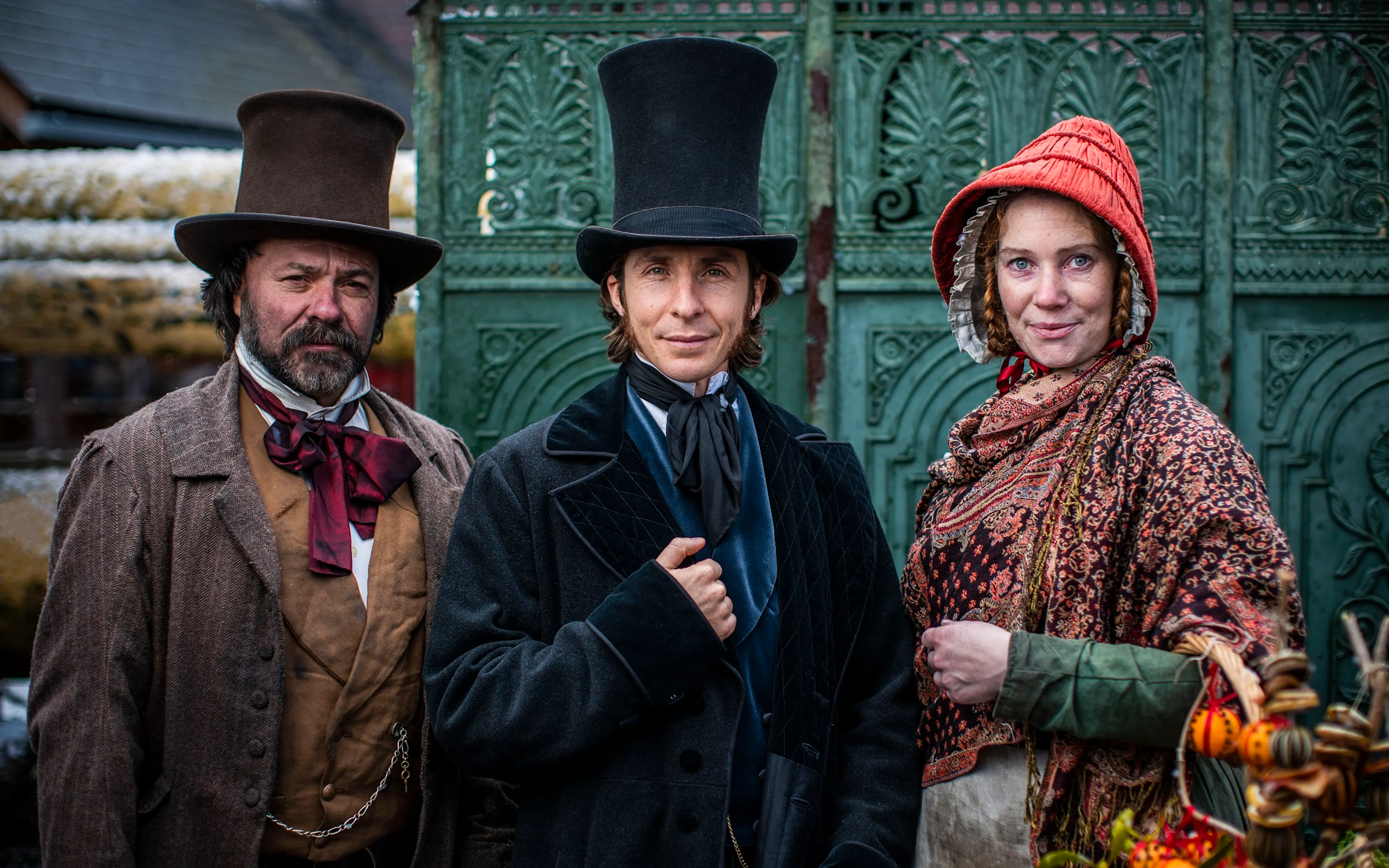 Three costume Victorian passengers ready to board the SS Great Britain  