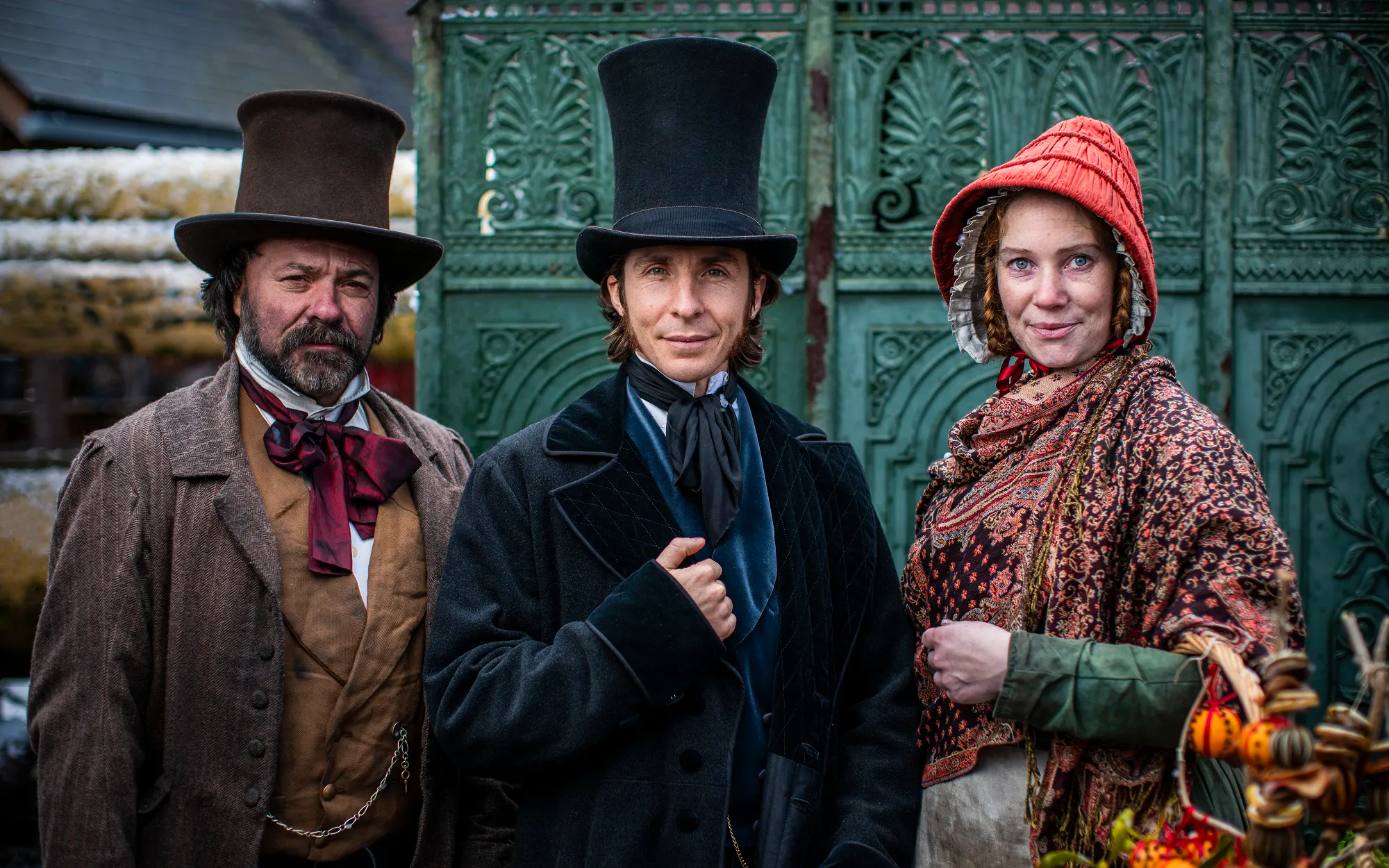 Three costume Victorian passengers ready to board the SS Great Britain