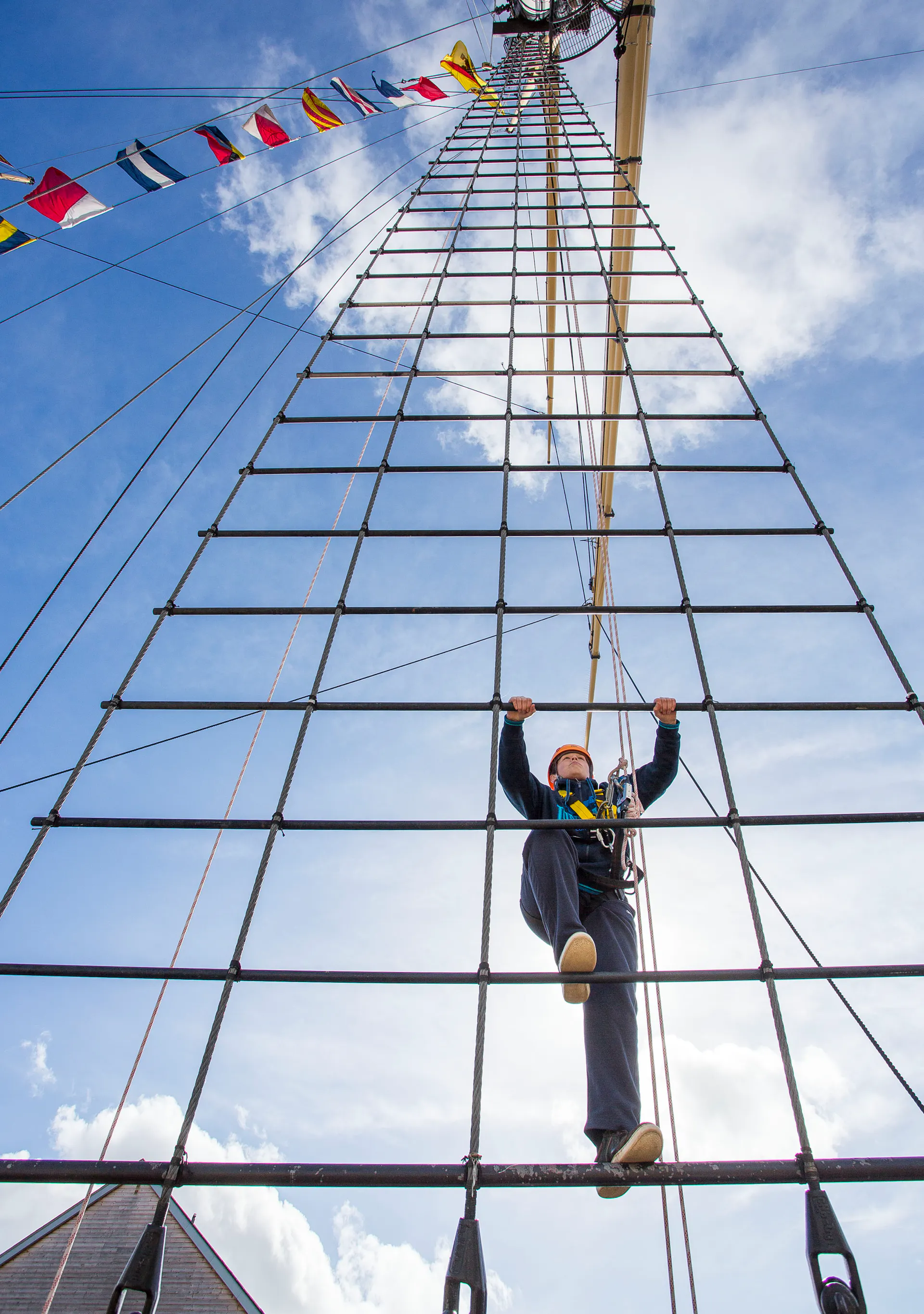 Someone climbing the rigging of the SS Great Britain. 