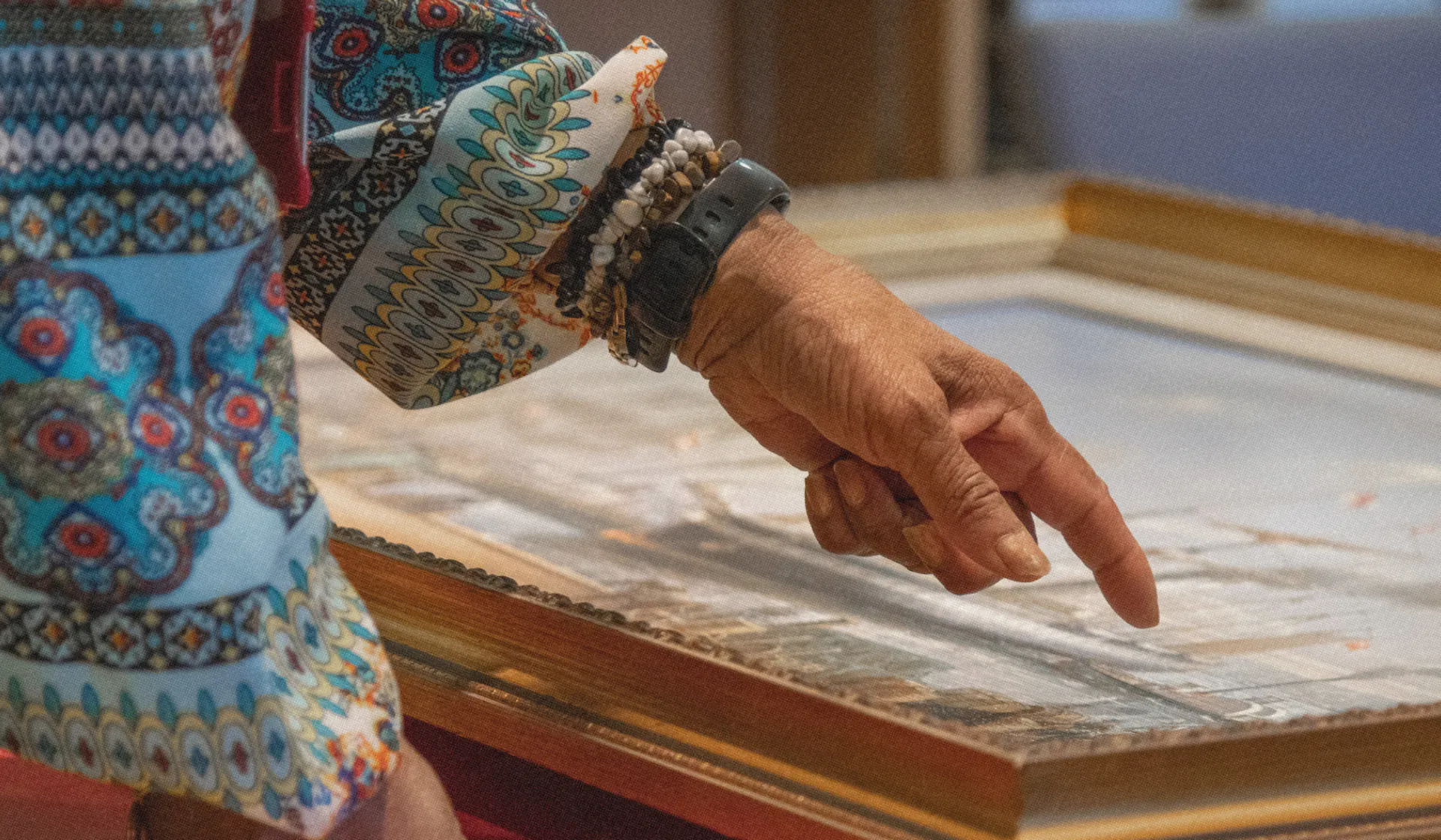 Community research painting with woman observing