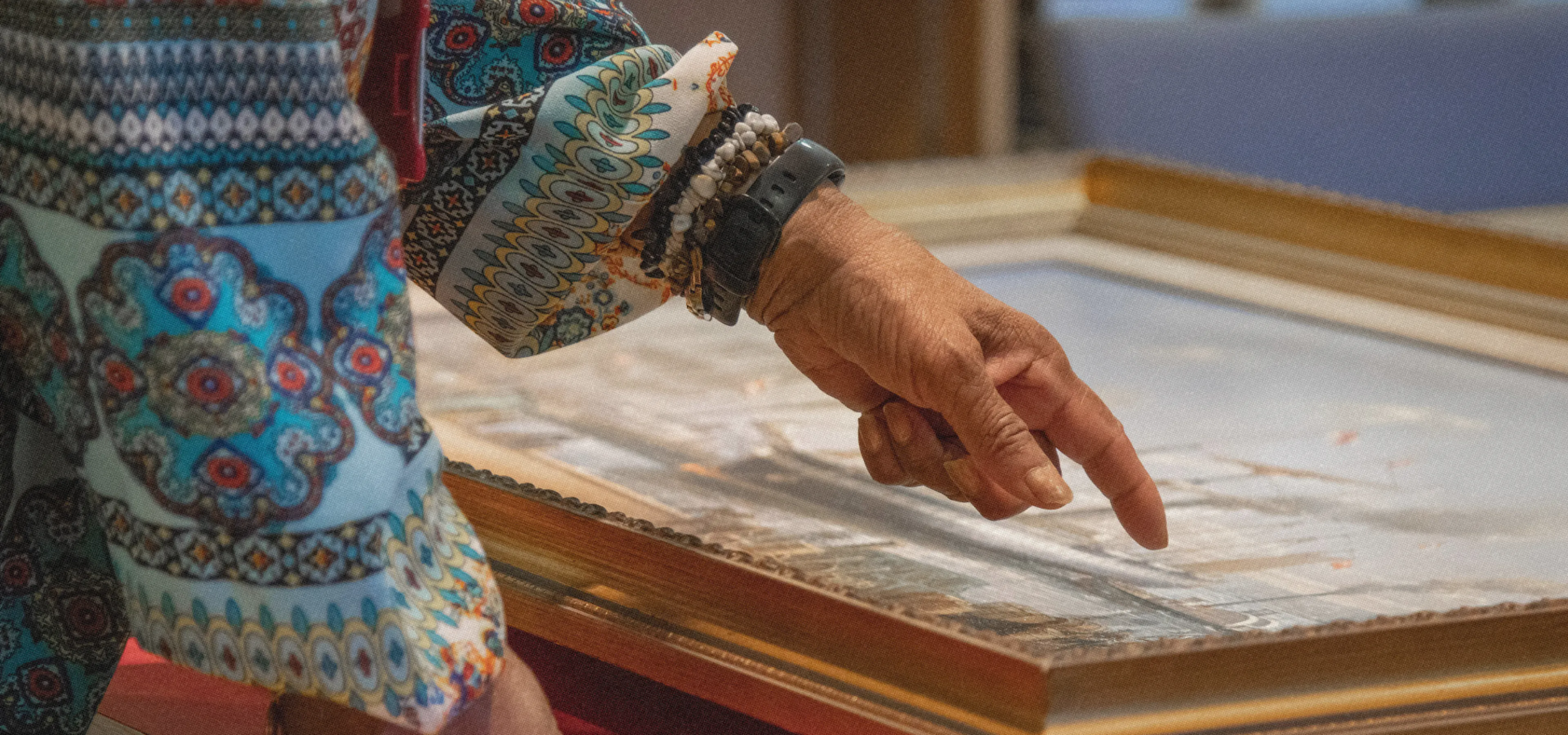 Woman pointing at painting artefact in the Brunel Institute at Bristol Dockyards 