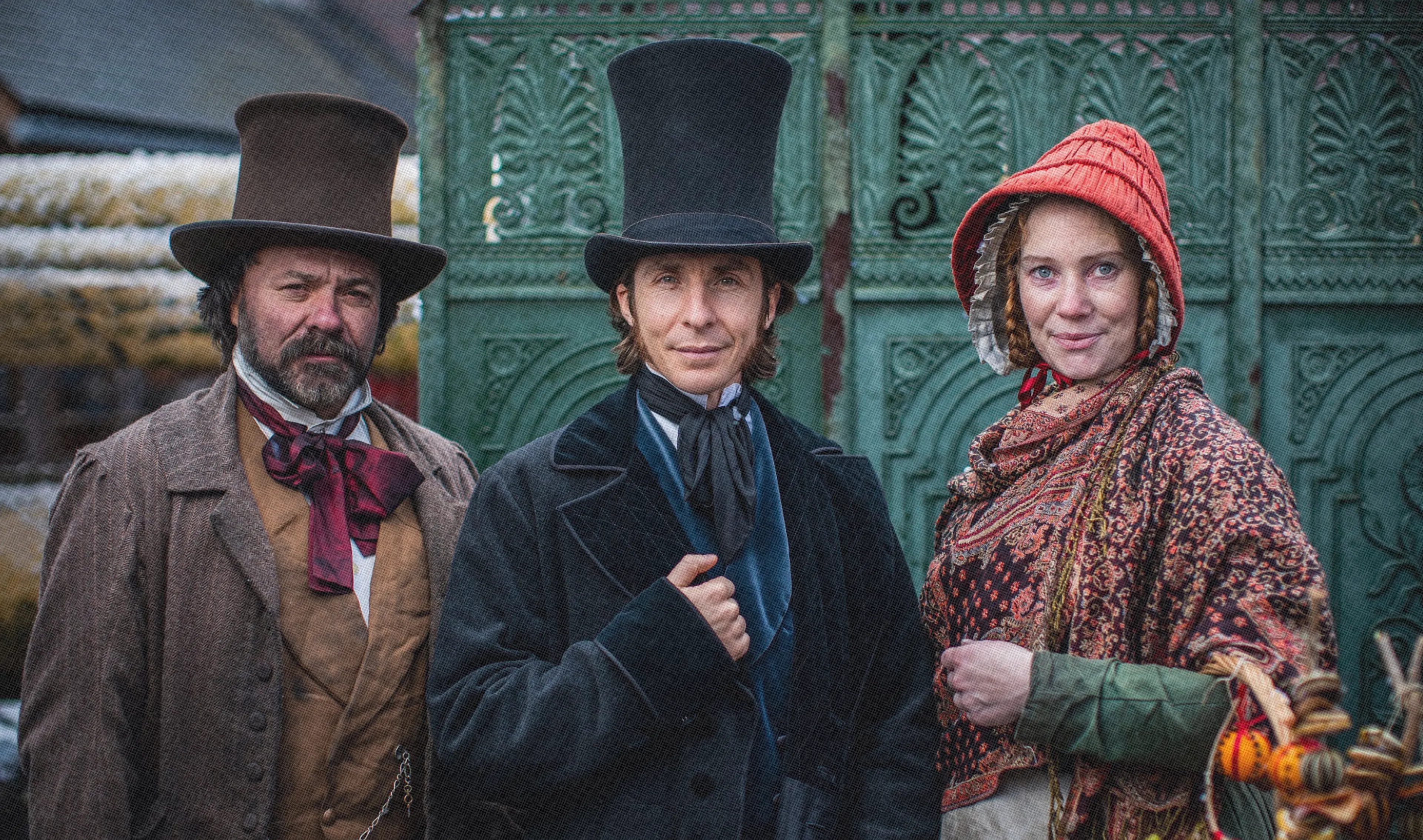 Three costume Victorian passengers ready to board the SS Great Britain