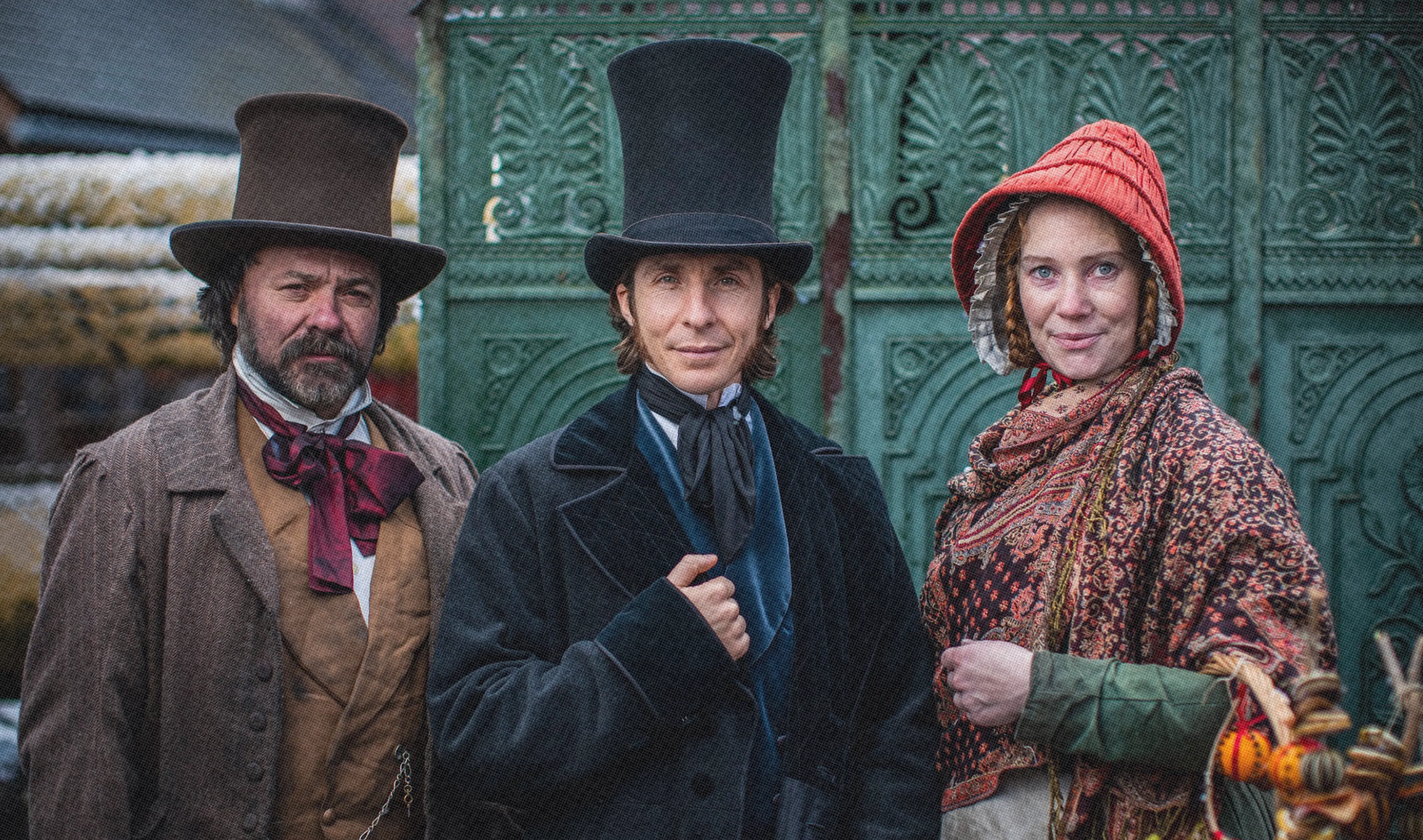 Three costume Victorian passengers ready to board the SS Great Britain  