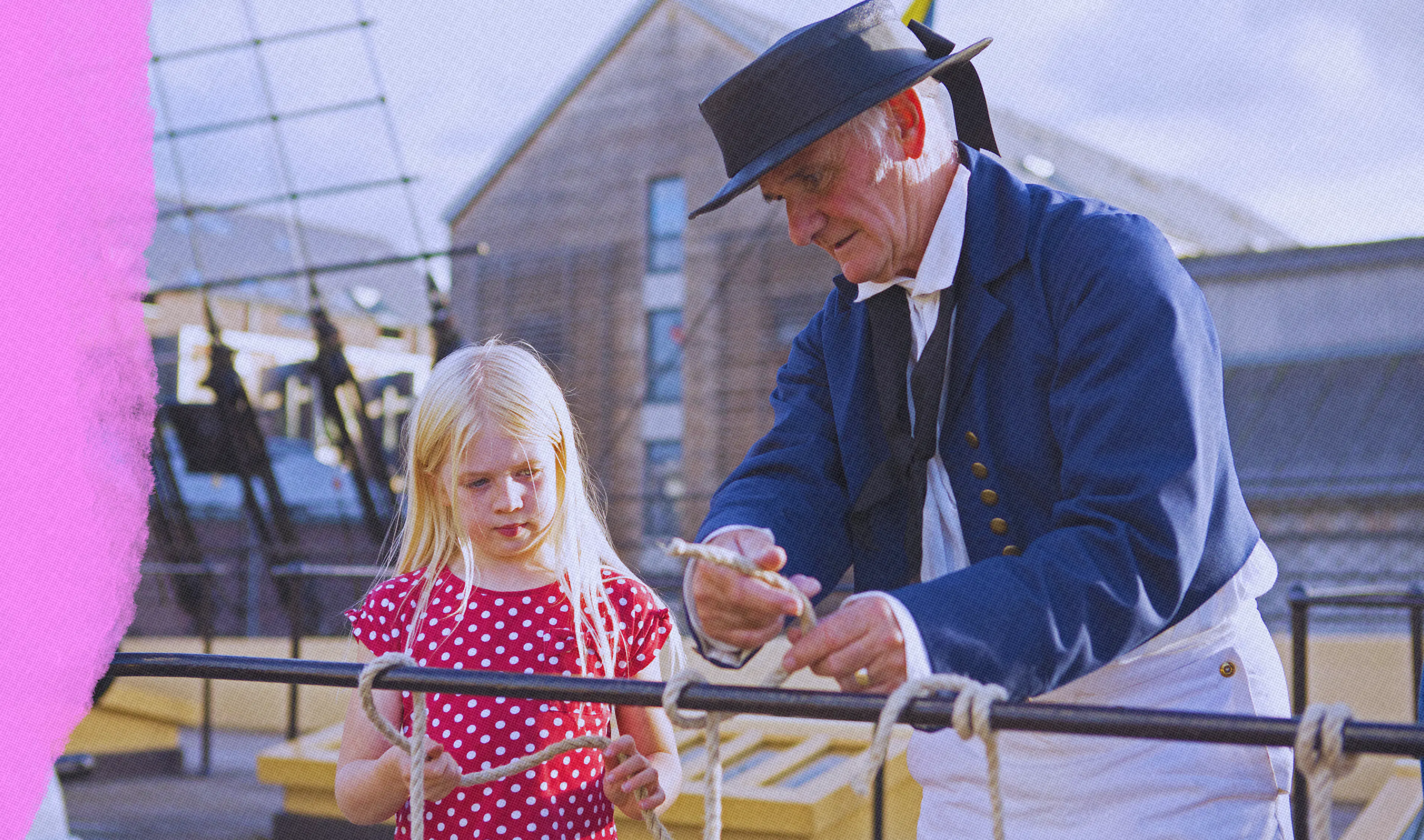 Member and child on weather deck of ship 