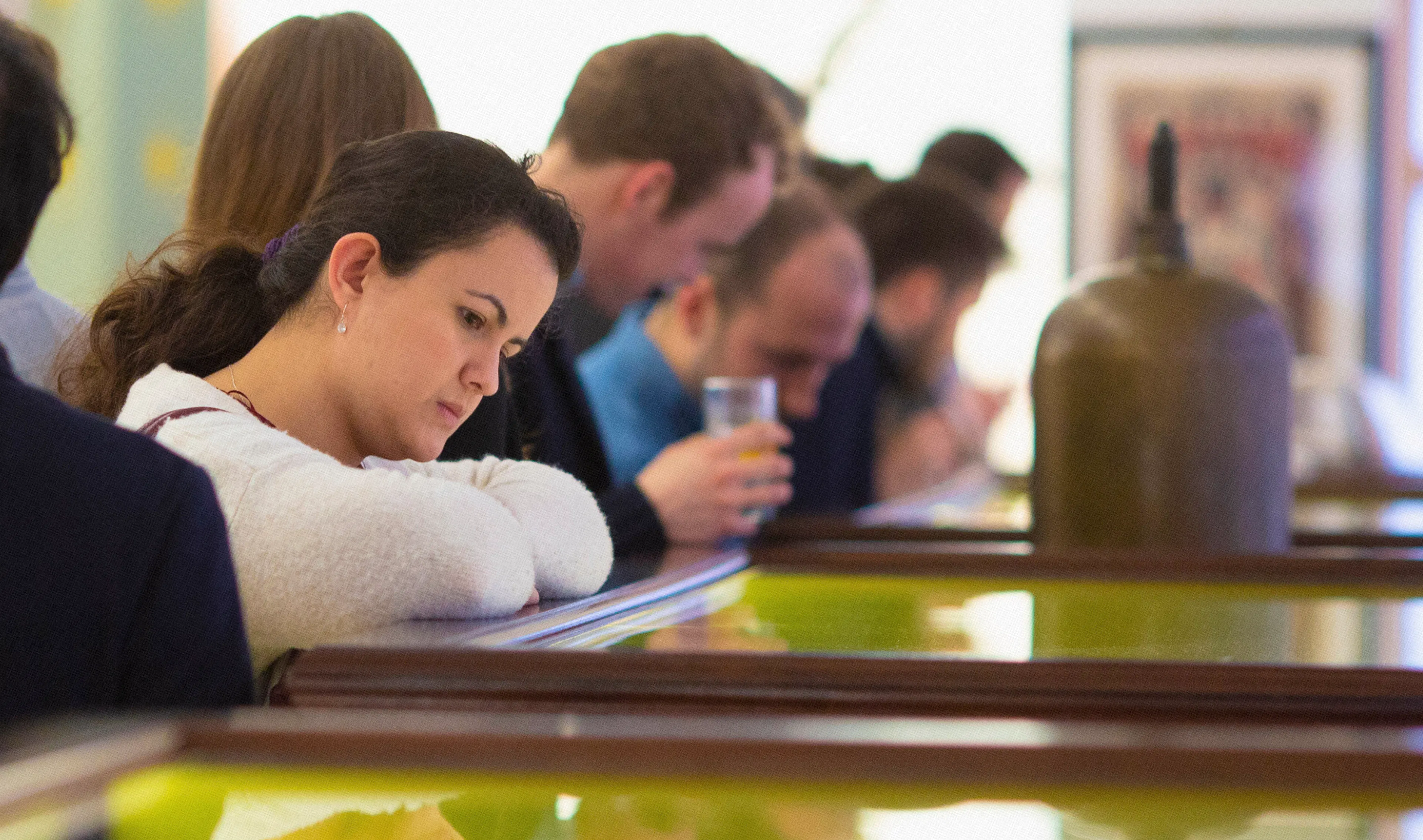 Woman looking at glass drawer in the Being Brunel Museum