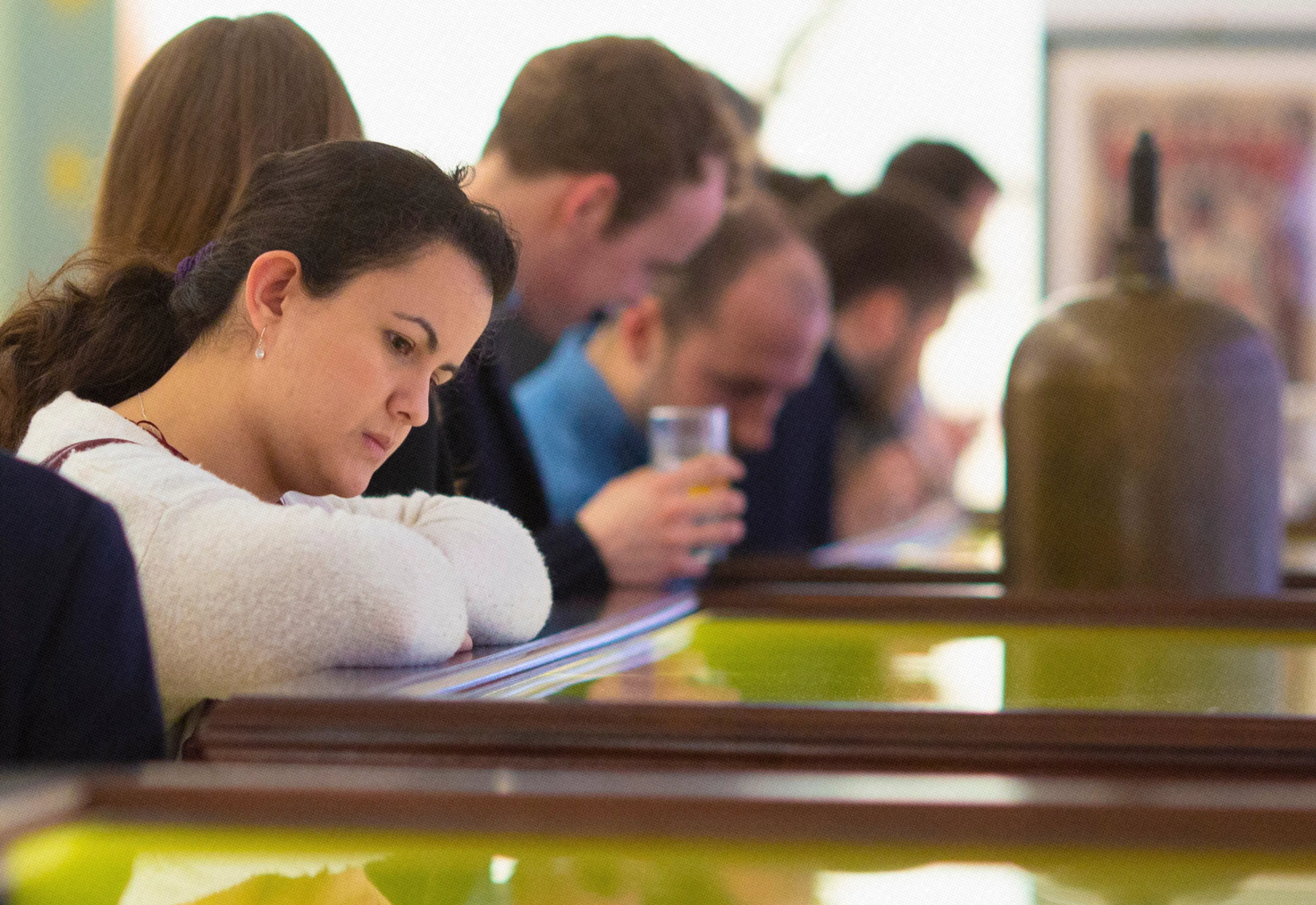 Woman looking at glass drawer in the Being Brunel Museum