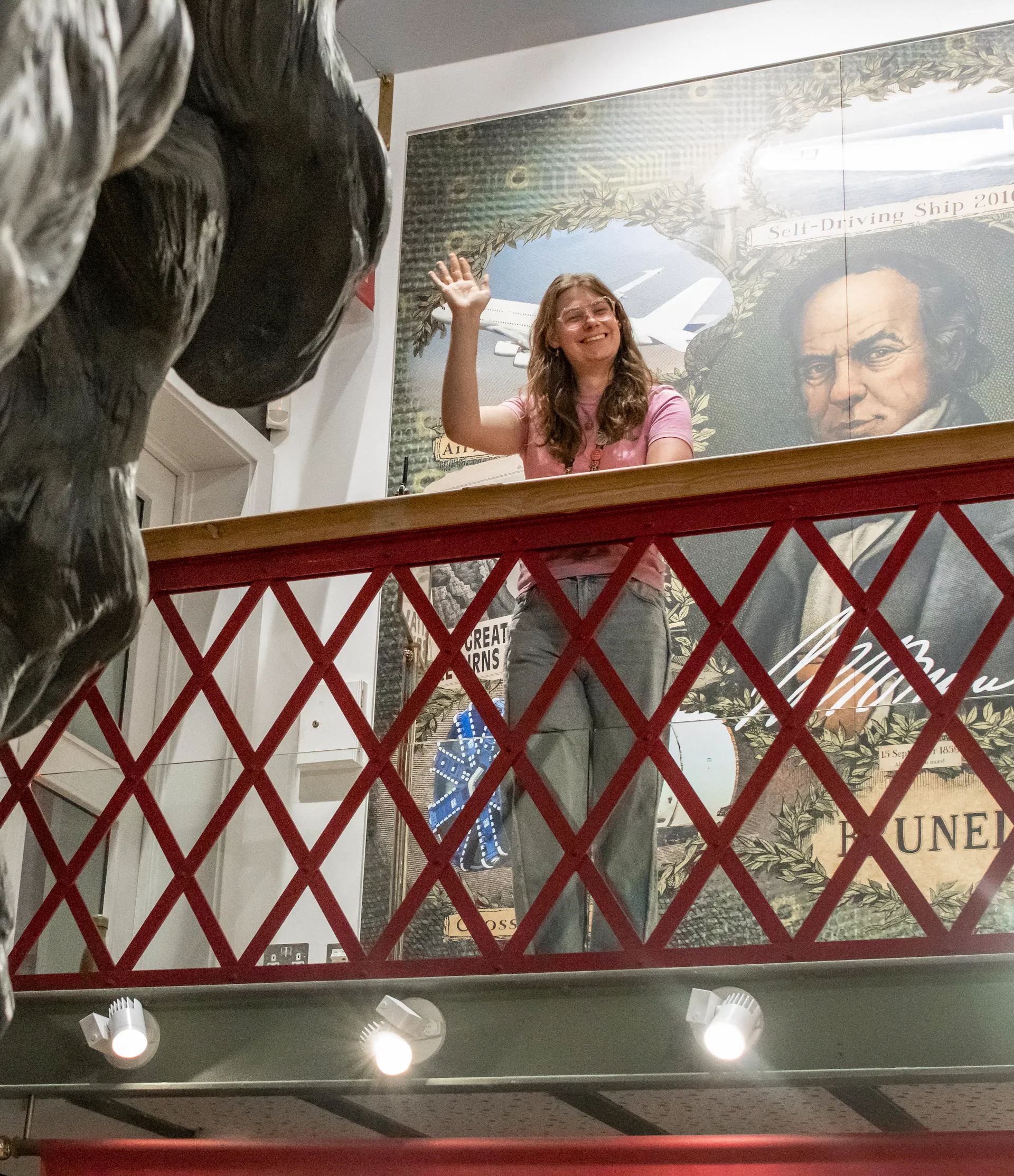 A member of staff waving from Being Brunel