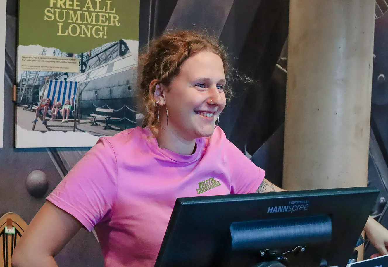 Member of the staff welcoming visitors
