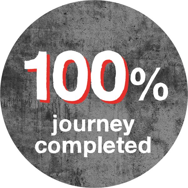 white text saying 100% journey completed with red highlight on dark grey background