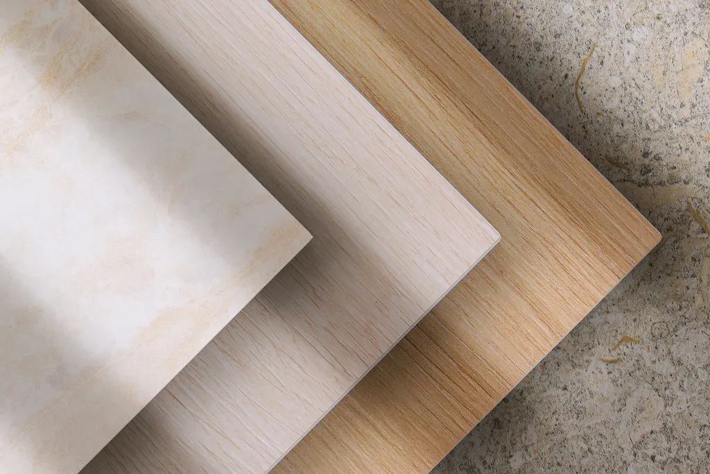 Dekton swatches laid out on natural background.