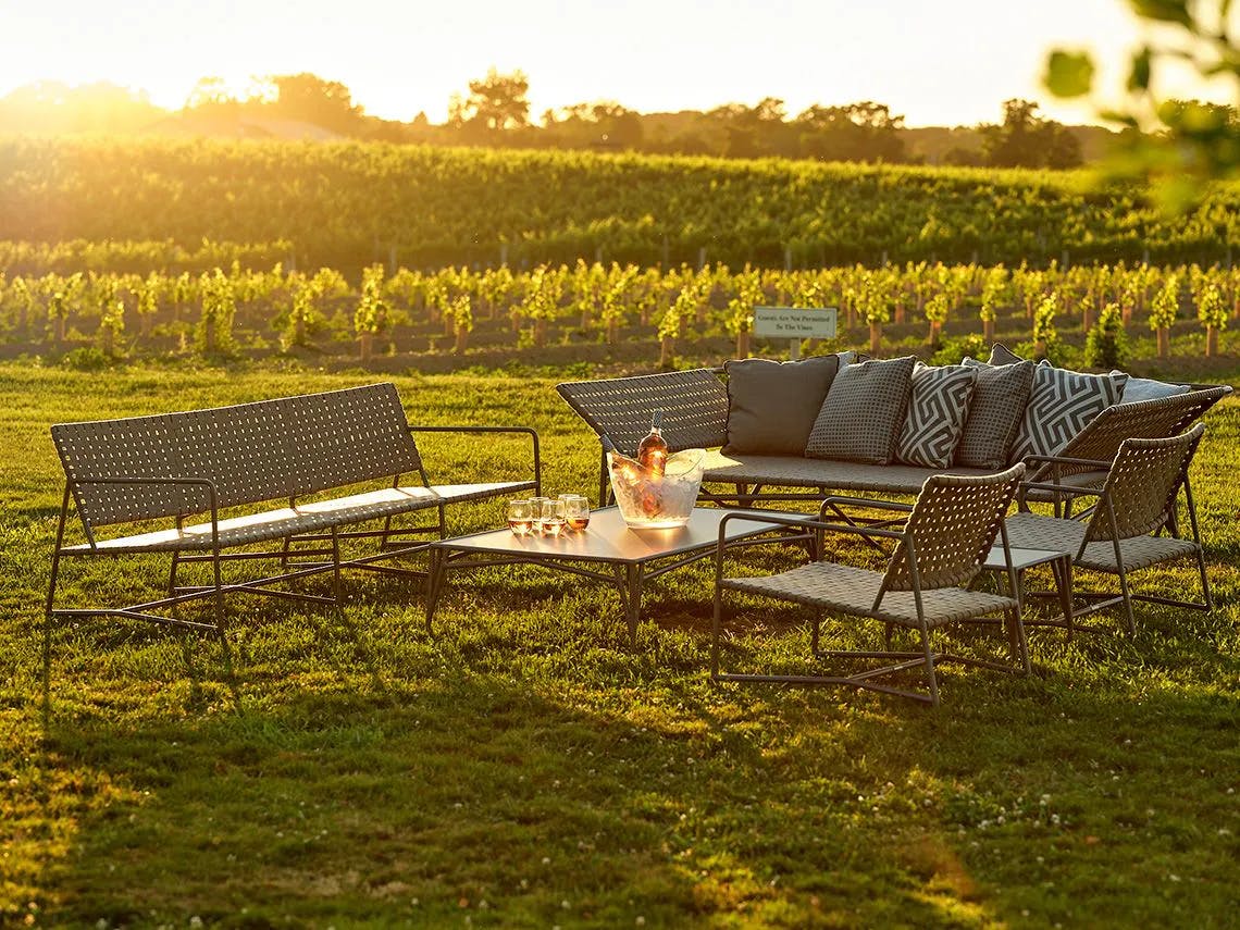 Designer Richard Frinier’s Stretch collection for Brown Jordan shown here in The Hilltop area of the Wölffer Estate Vineyard.