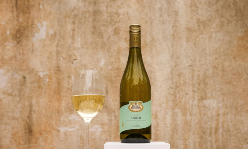 A bottle of Brown Brothers Classic Fiano with a glass of wine